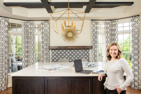 woman in white shirt in front of desk