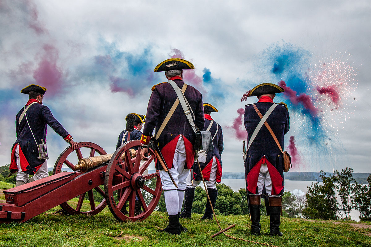 mount vernon fourth of july celebration with cannon shooting out red, white and blue fireworks