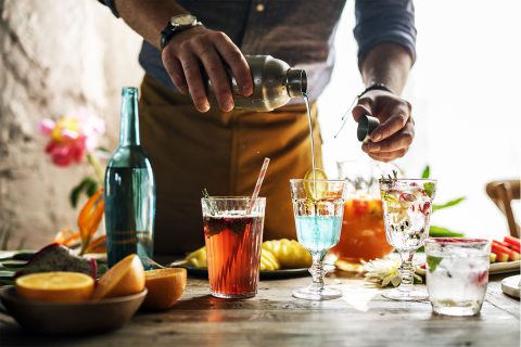 man pouring cocktails