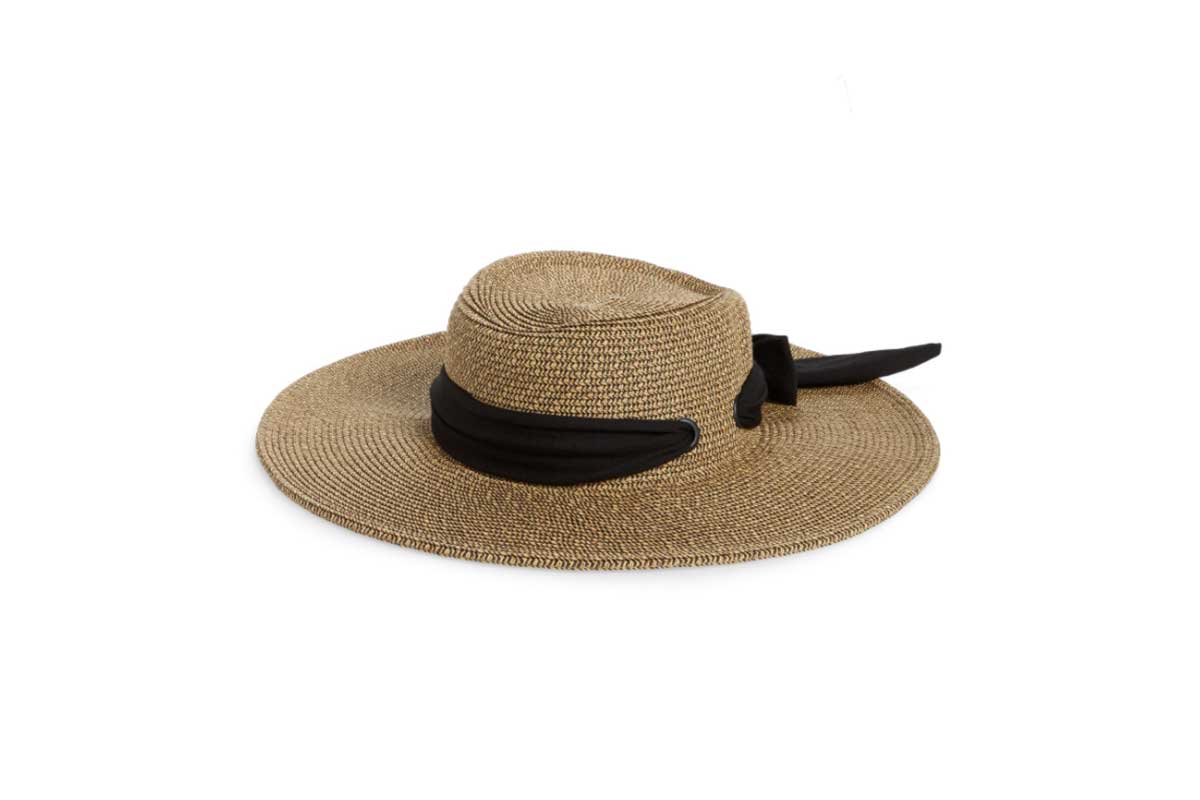 black and tan straw hat with black scarf