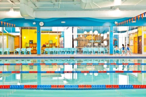 indoor swimming pool with blue and red and yellow