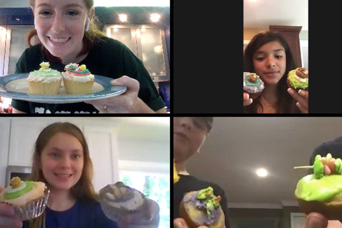 screenshot of zoom call with kids holding cupcakes