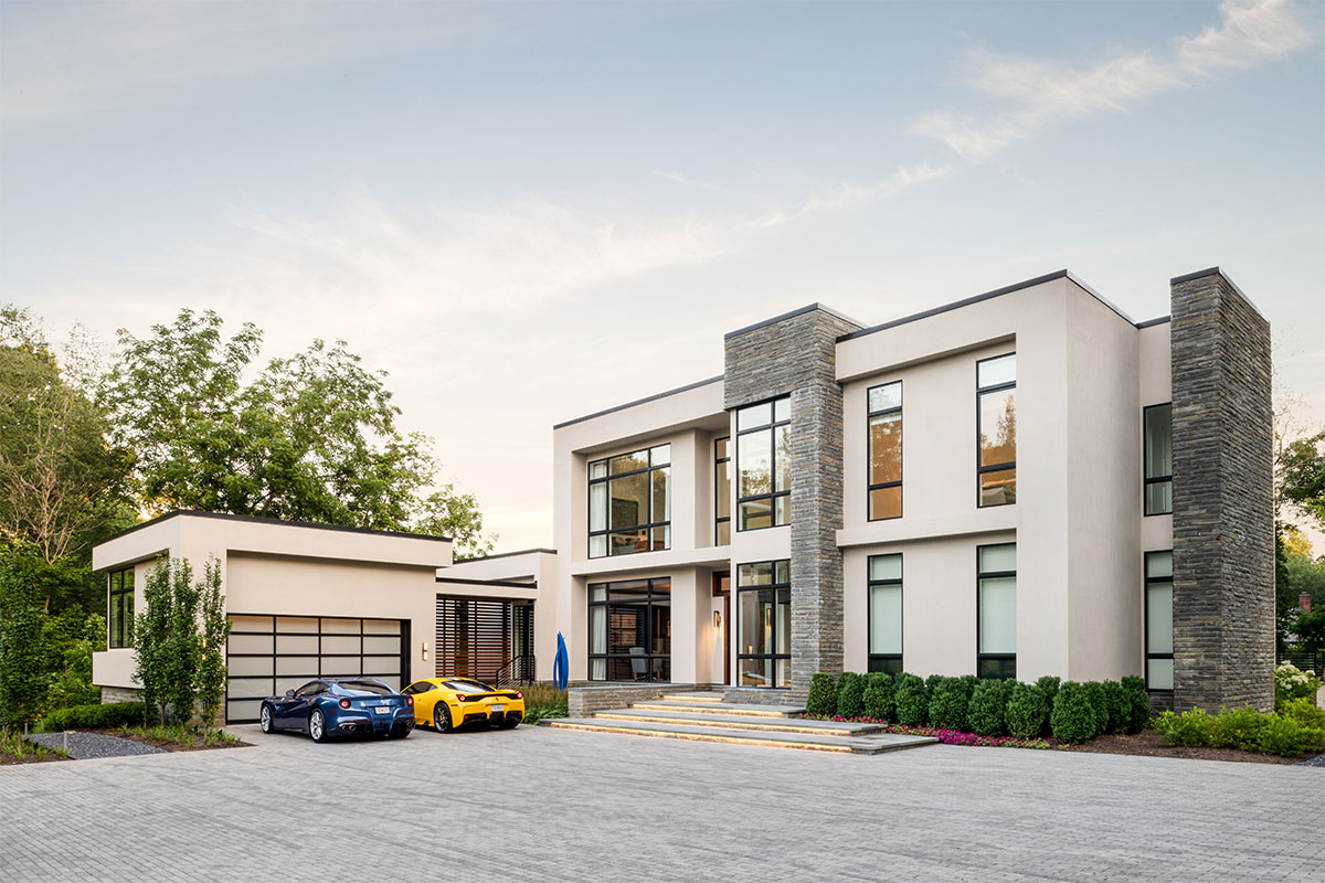exterior of modern house with cars parked out front