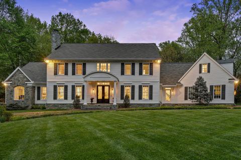 outside of a home with sunset behind