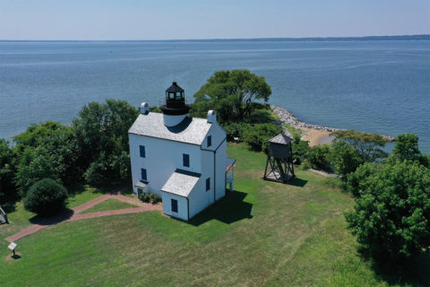 white house near body of water