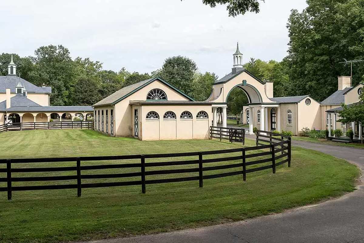 outdoor horse stables with wooden fence