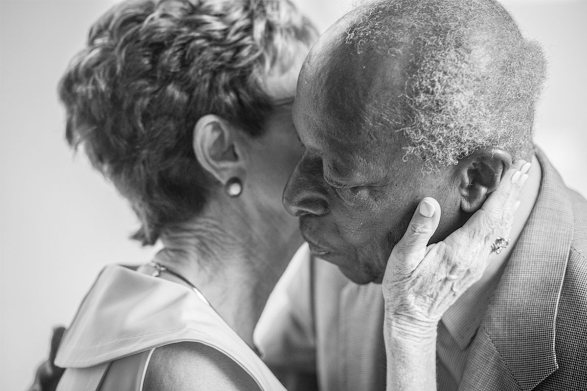 interracial older couple sharing intimate moment