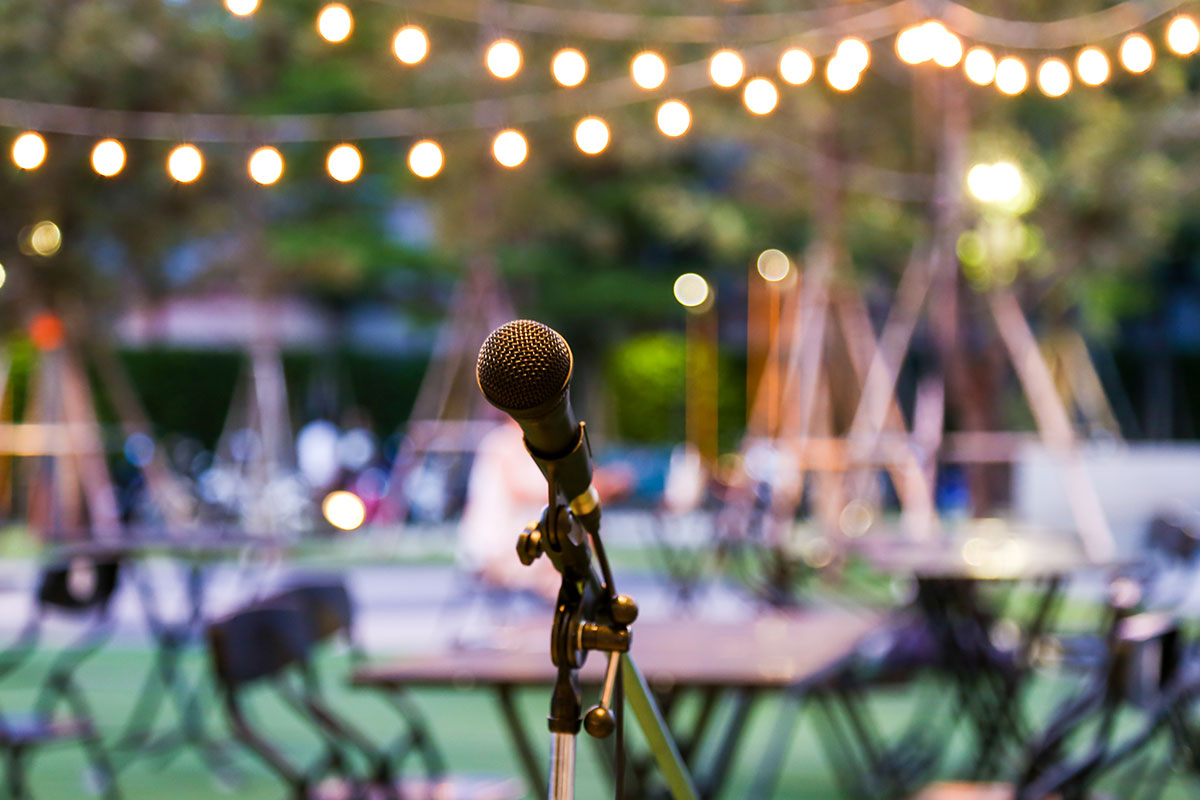 outdoor microphone with tables in the back