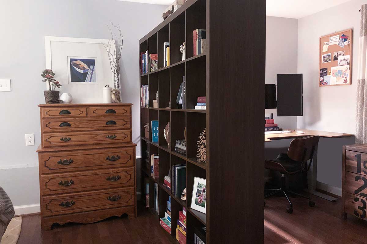 room with large black cube shelf and large dresser