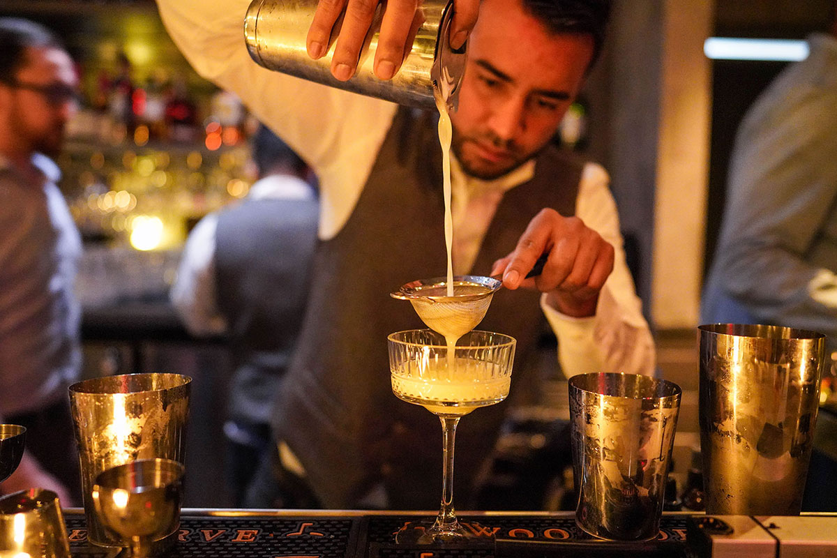 bartender pouring a drink
