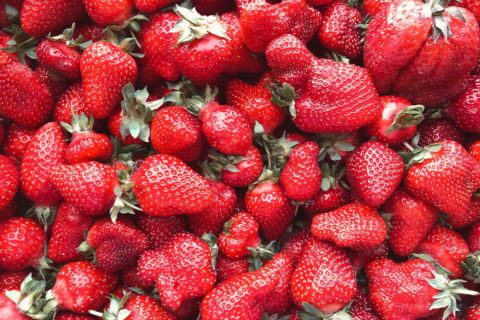 red strawberries with green leaves