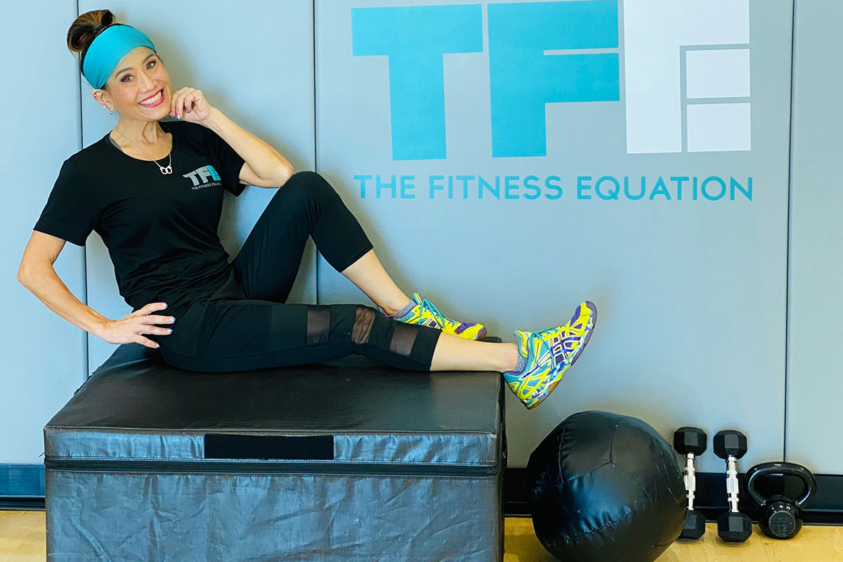 woman on workout materials at the fitness equation