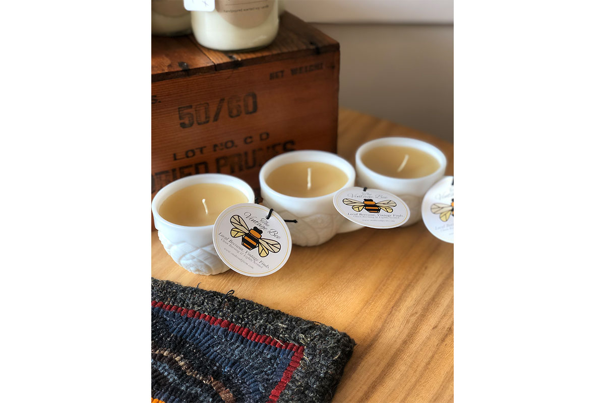 candles with bee logo