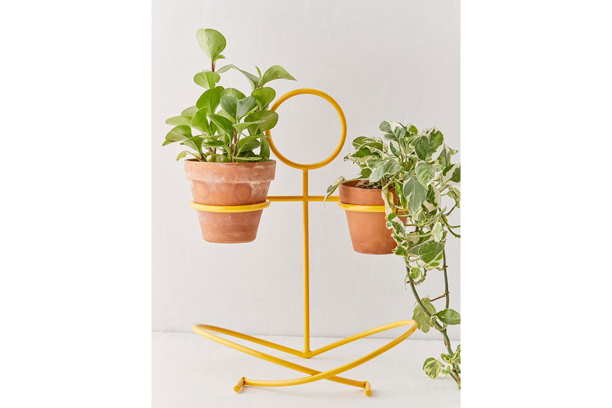 yellow human plant holder
