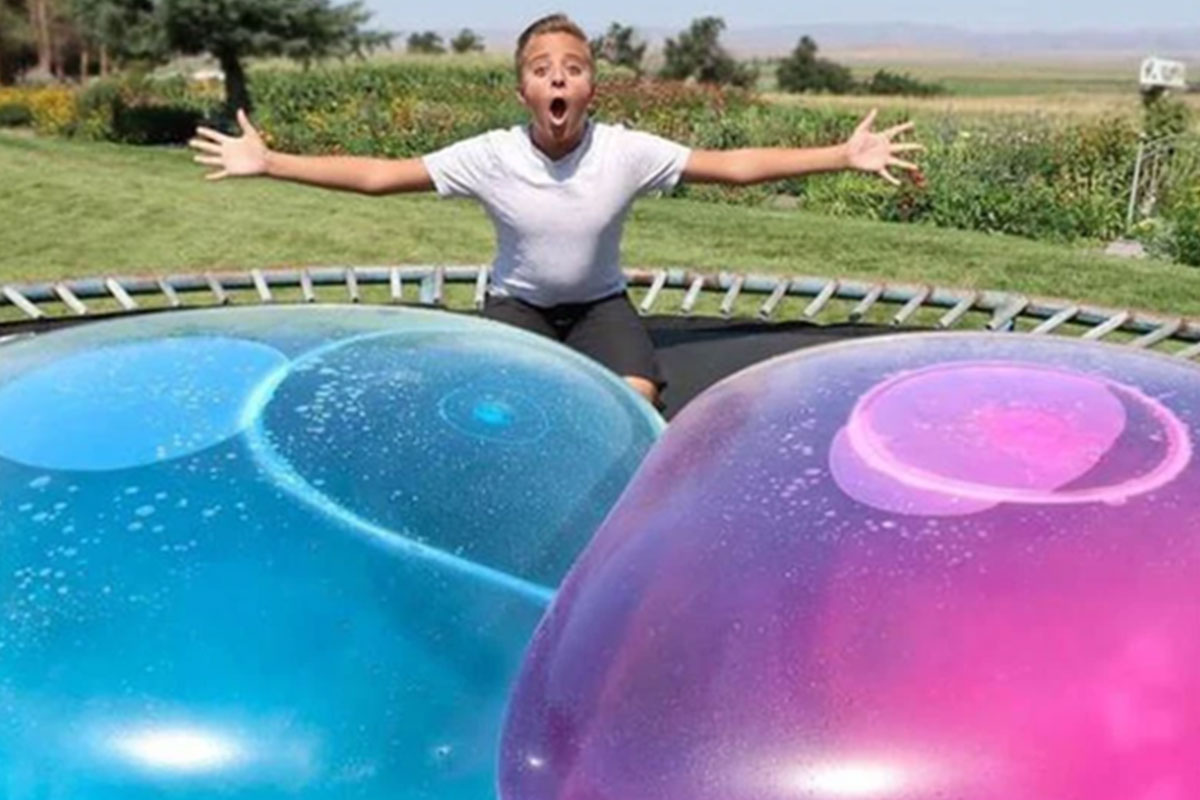 blue and purple bubbles with boy behind them