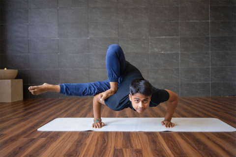 man doing hard yoga pose