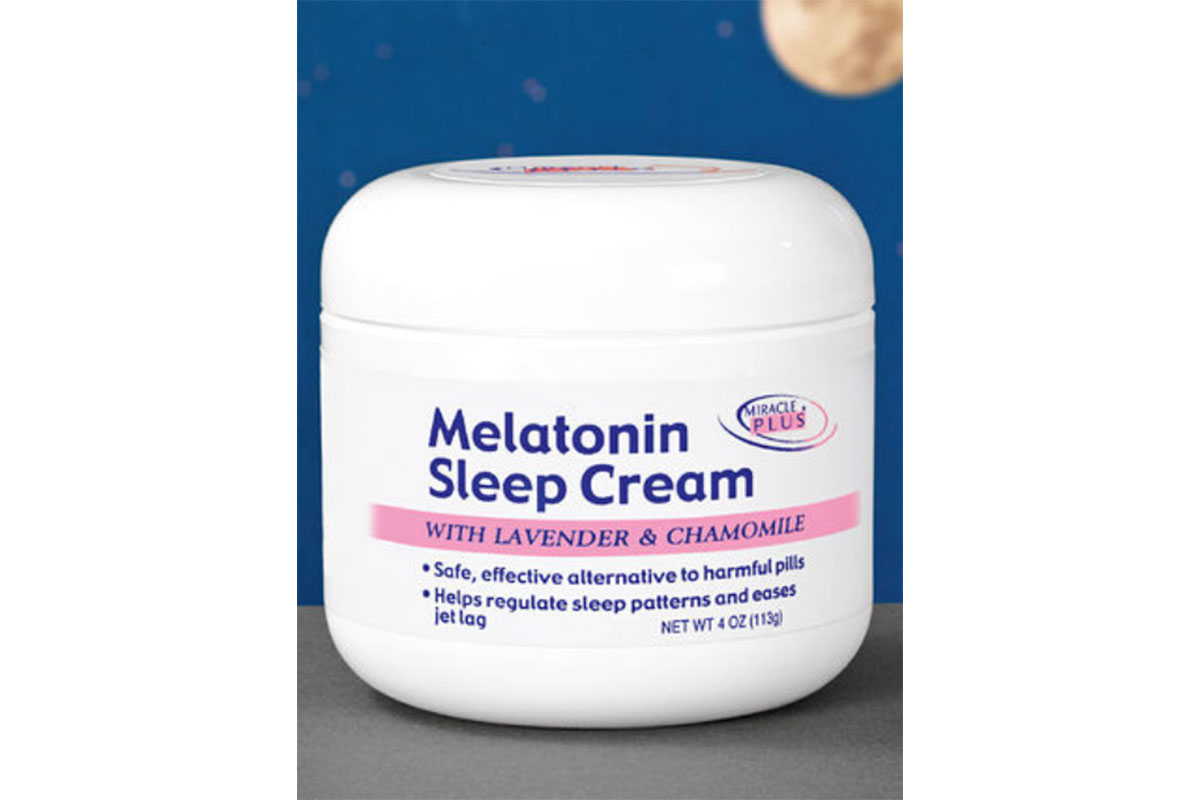 melatonin sleep cream in white bottle