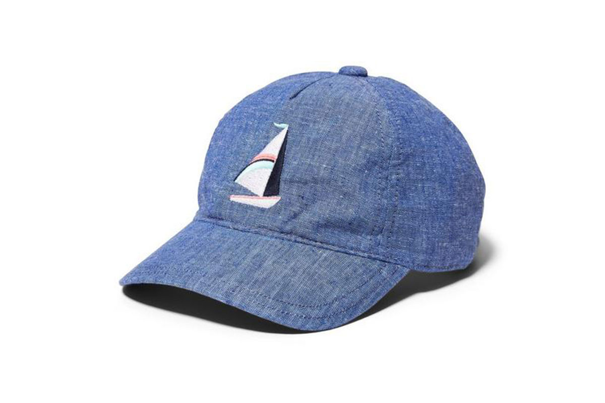blue sail boat on hat