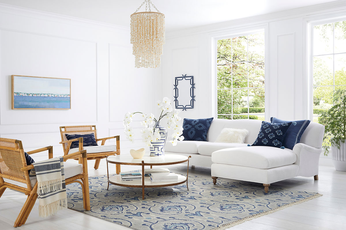 living room with shell chandelier and white couches from Serena & Lily