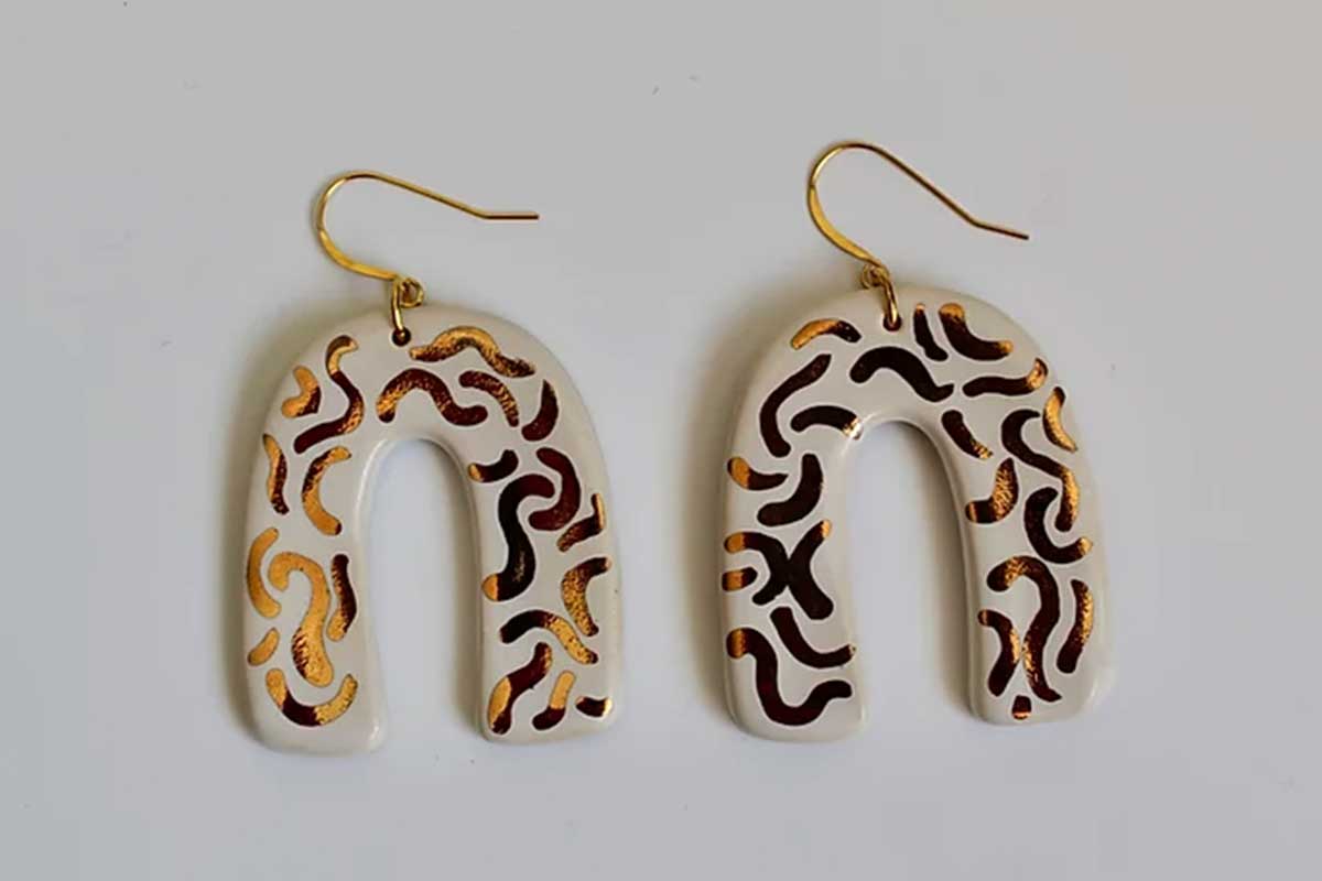white and gold rainbow shaped earrings