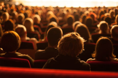 back of peoples heads at theater
