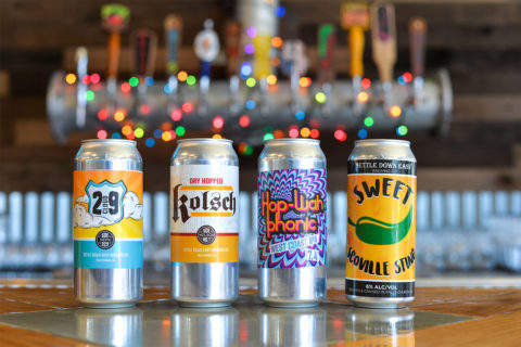 four cans of beer in a row