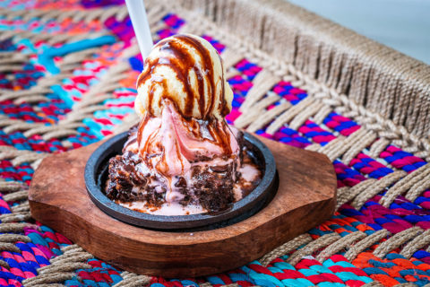 ice cream scoops with chocolate syrup on top