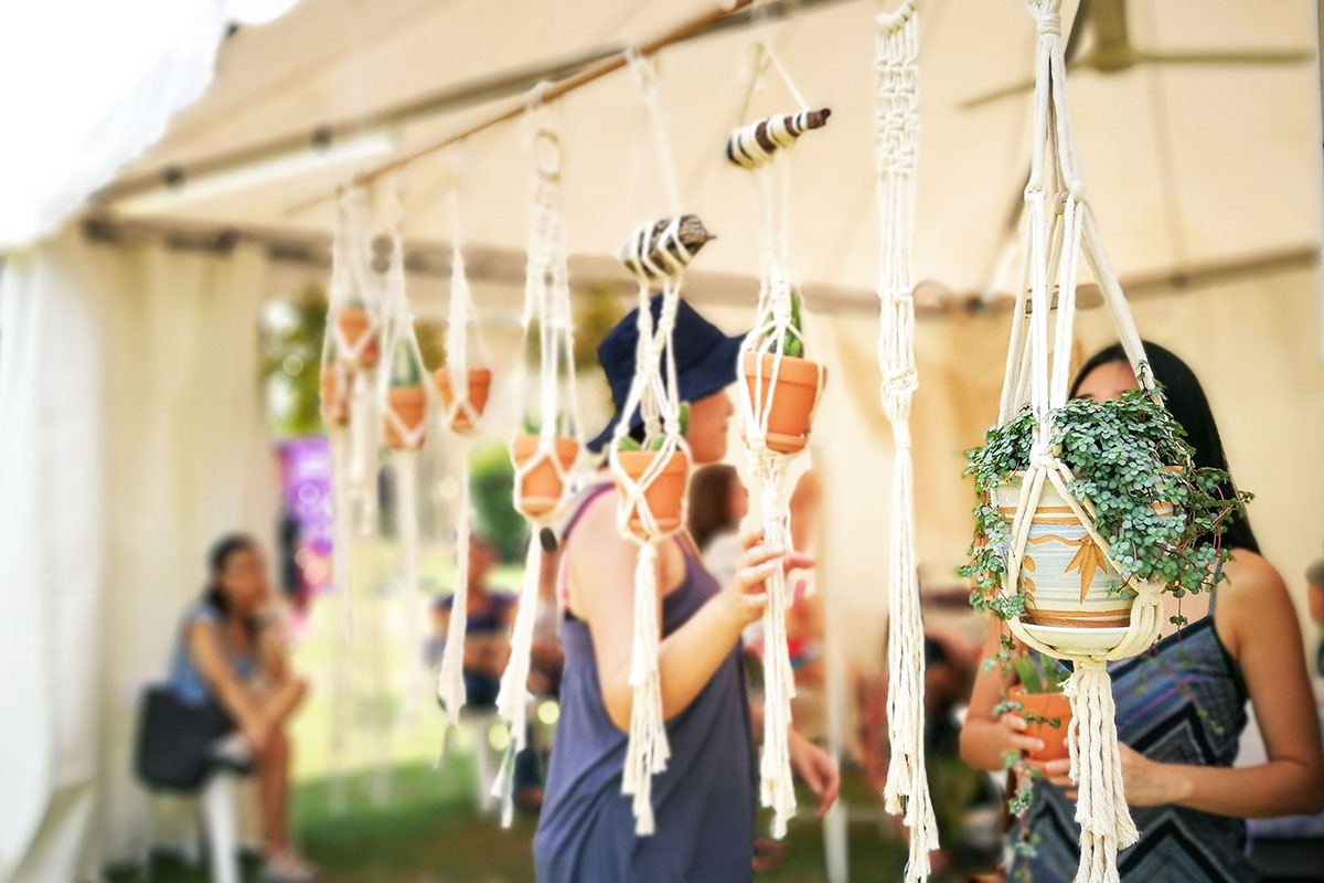 plants hanging at a craft fair