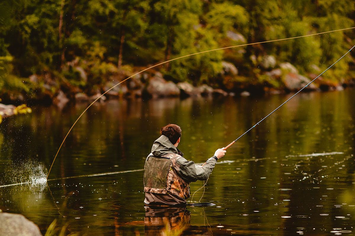 man fishing in water