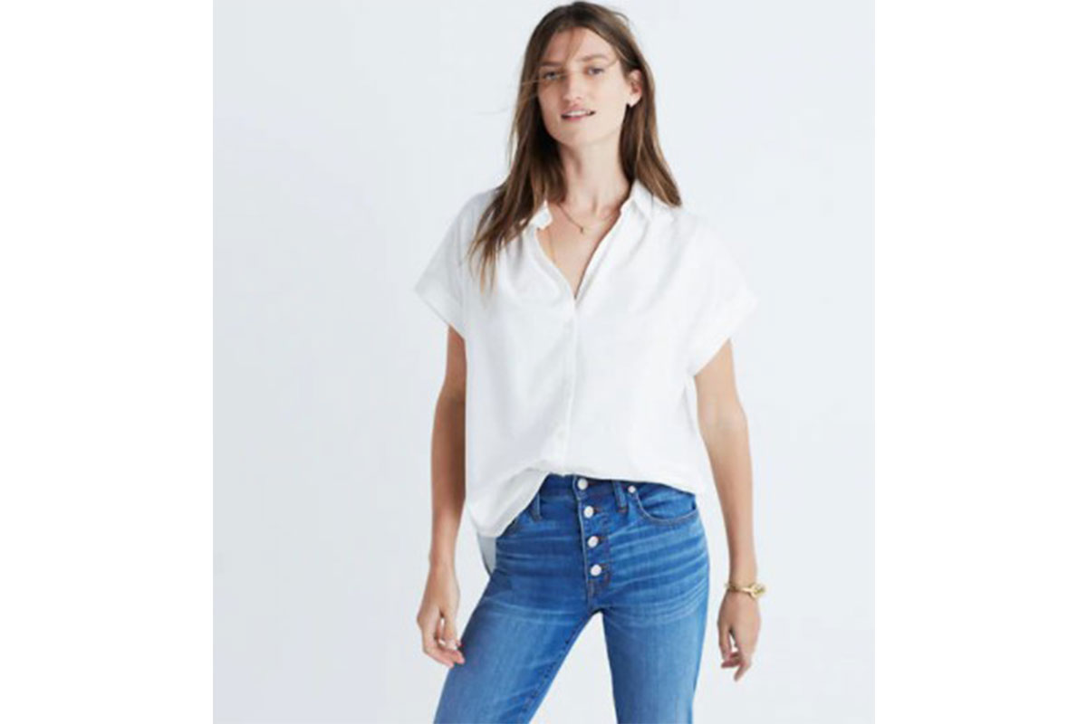 woman wearing white button up shirt