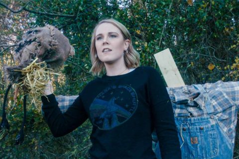 GetAWAY cast member holding scarecrow