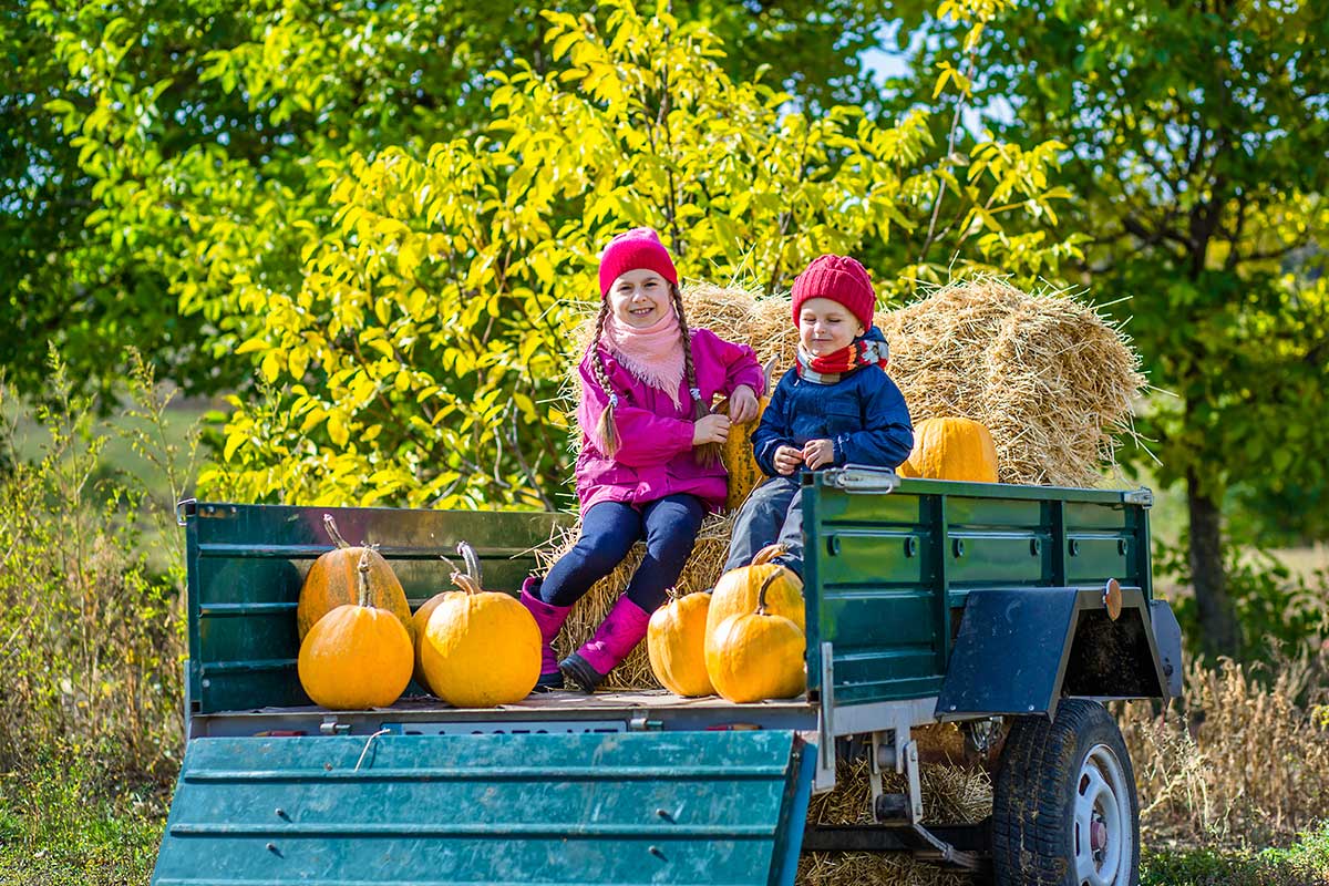 two kids riding on hayride