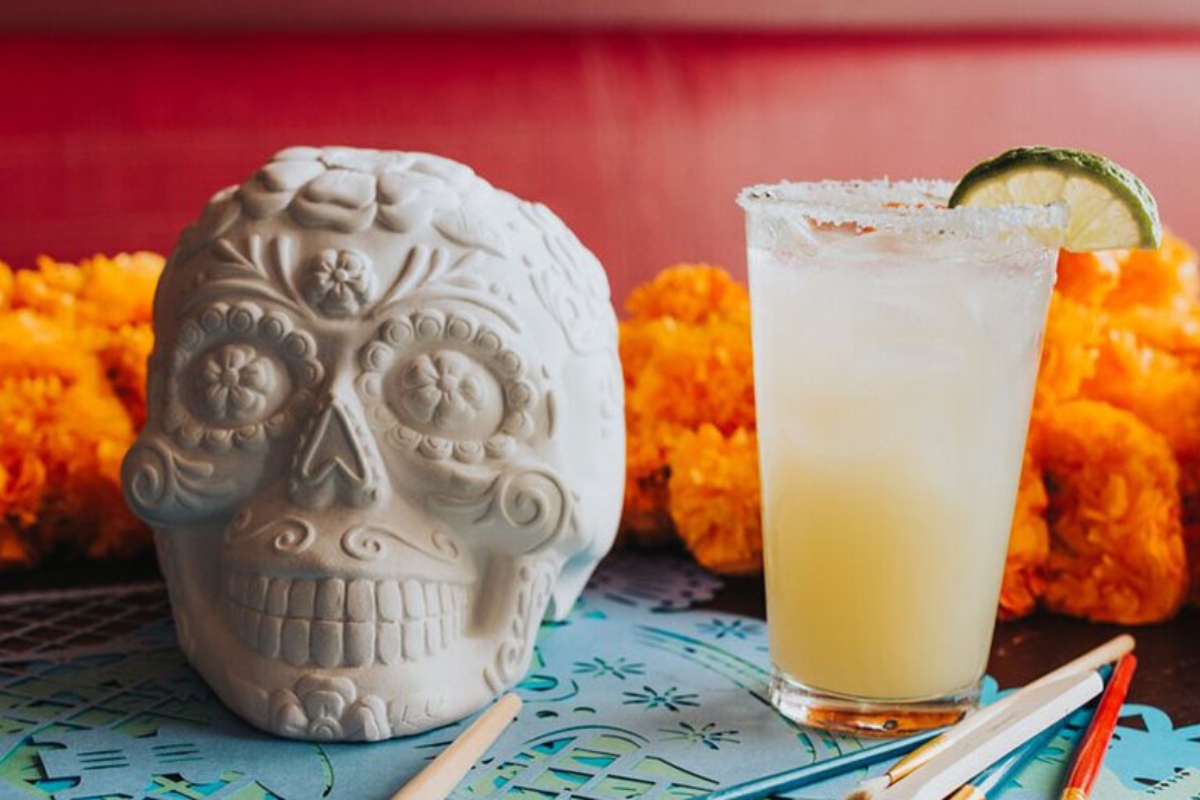 Paint your own ceramic sugar skull as part of a meal to remember at La Sandia.