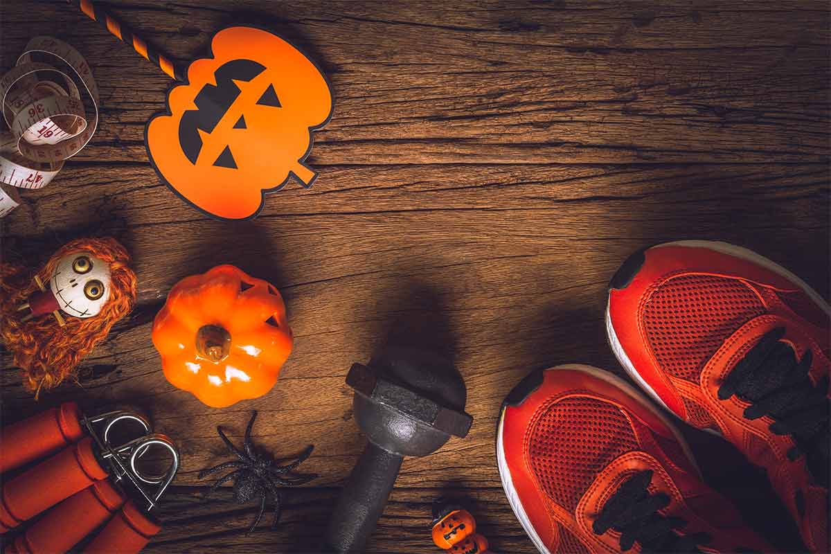 running shoes and weights with halloween decor