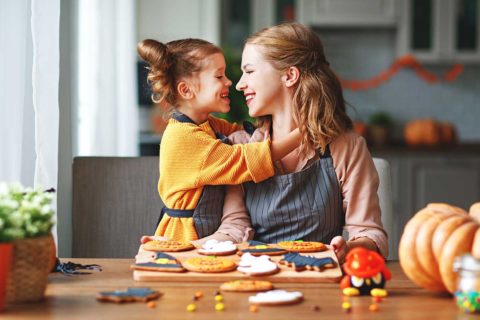 mother and daughter decorating cookies