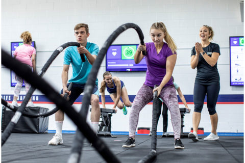 Teenagers working out with ropes
