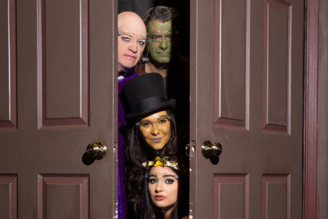 Four monsters looking out of door