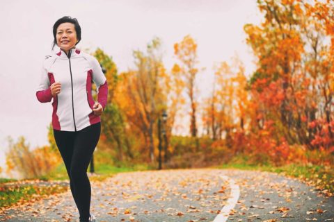 woman running on road during fall
