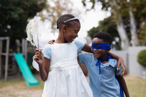 little boy and girl wearing costumes
