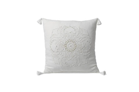 white embroidered pillow