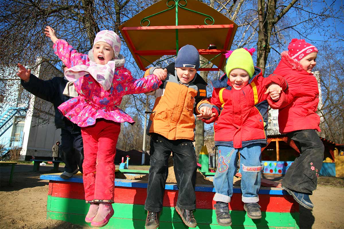 kids jumping on playground