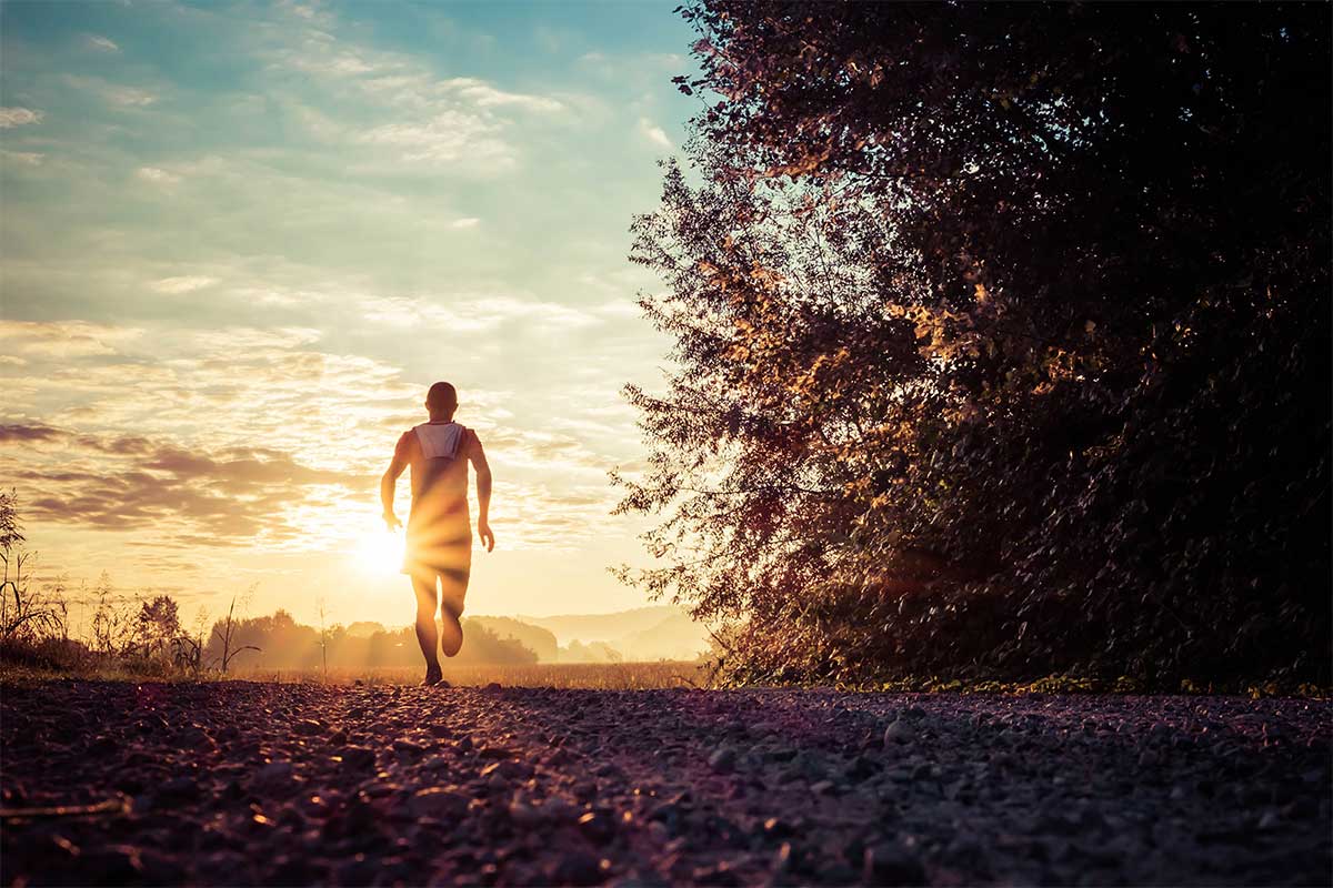 man running during sunrise