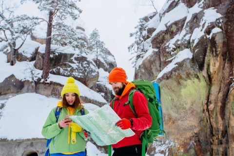 man and woman looking at map