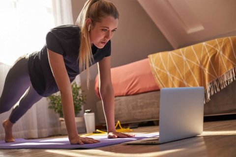 woman doing yoga at home