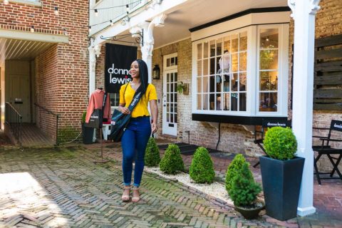 woman walking out of store