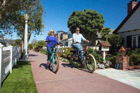 man and woman biking