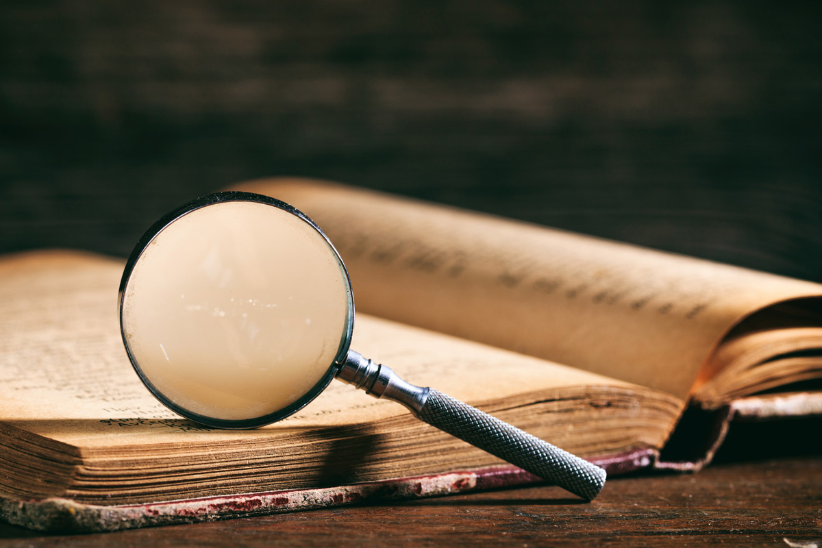 Magnifying glass and book