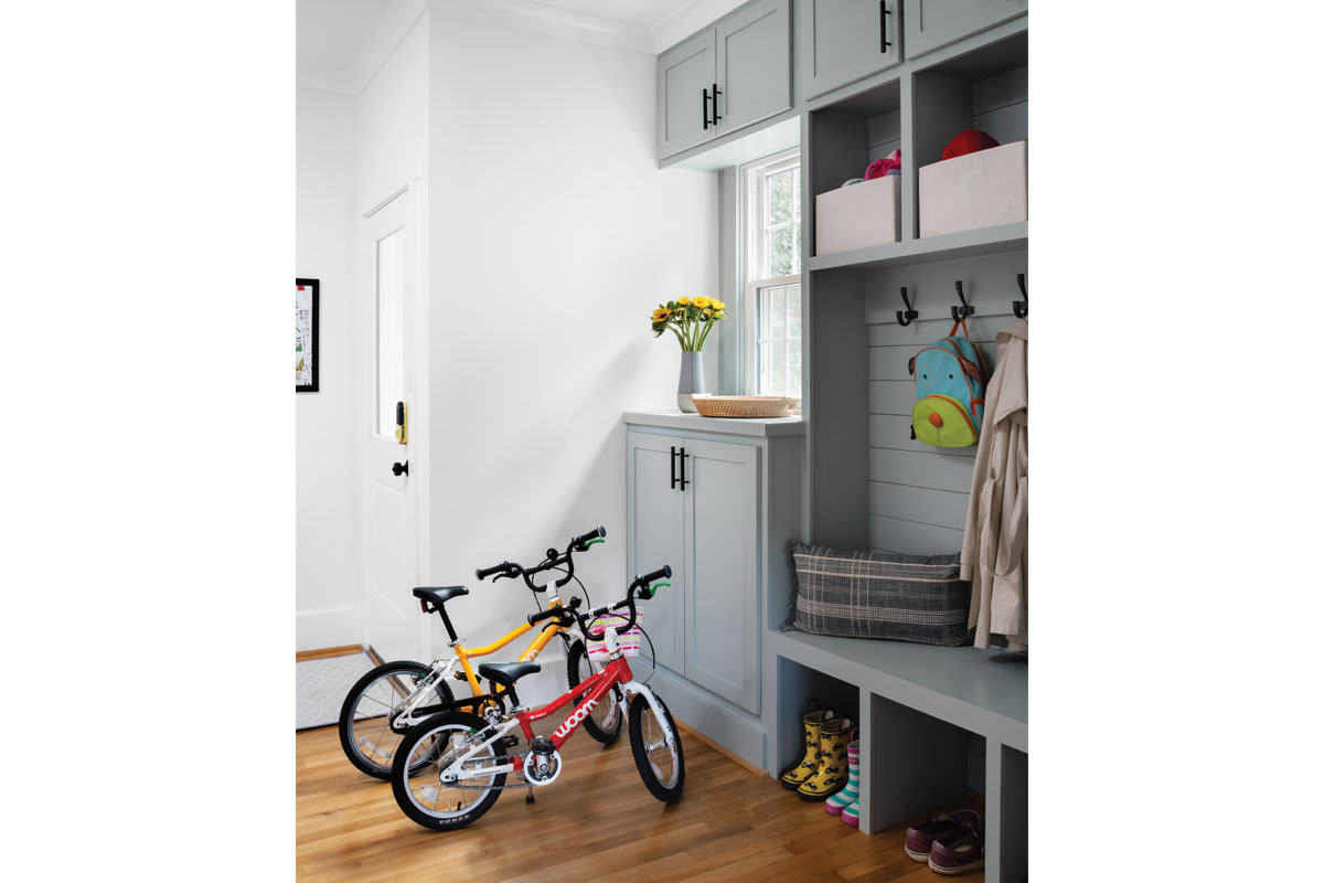gray mudroom with bikes