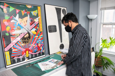 Antonio Alcala looking at stamps