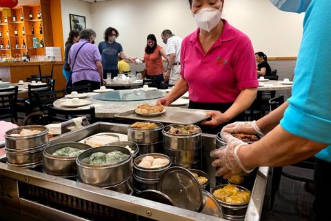 Servers bring out dim sum at Mark's Duck House